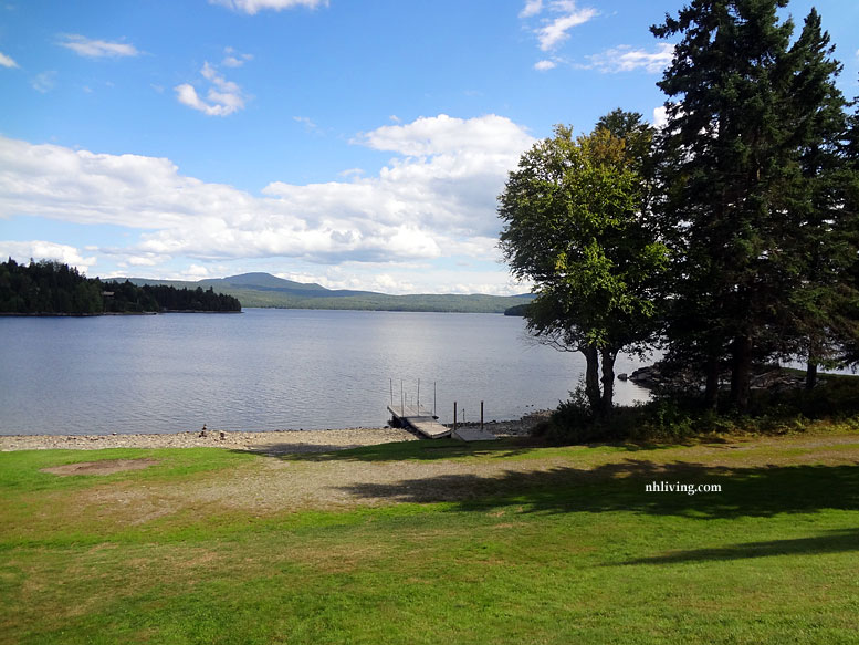 New England Lakeside Vacations summer view of a Dock on a New Hampshire Lake from NELivingMagazine.com